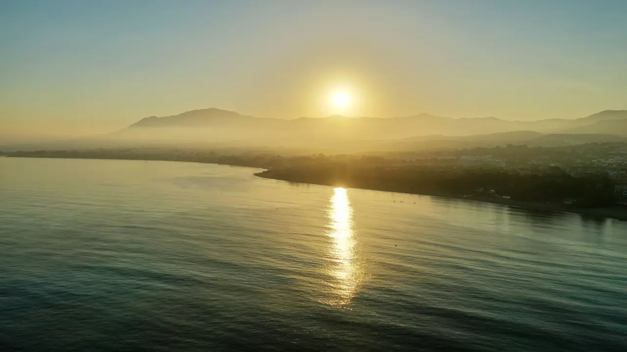 Sunset in Marbella, with the sea and mountains in the background